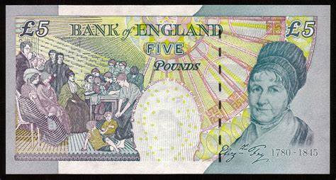 A £5 bank of england note featuring elizabeth fry on the right, and a historical scene of her reform work on the left.